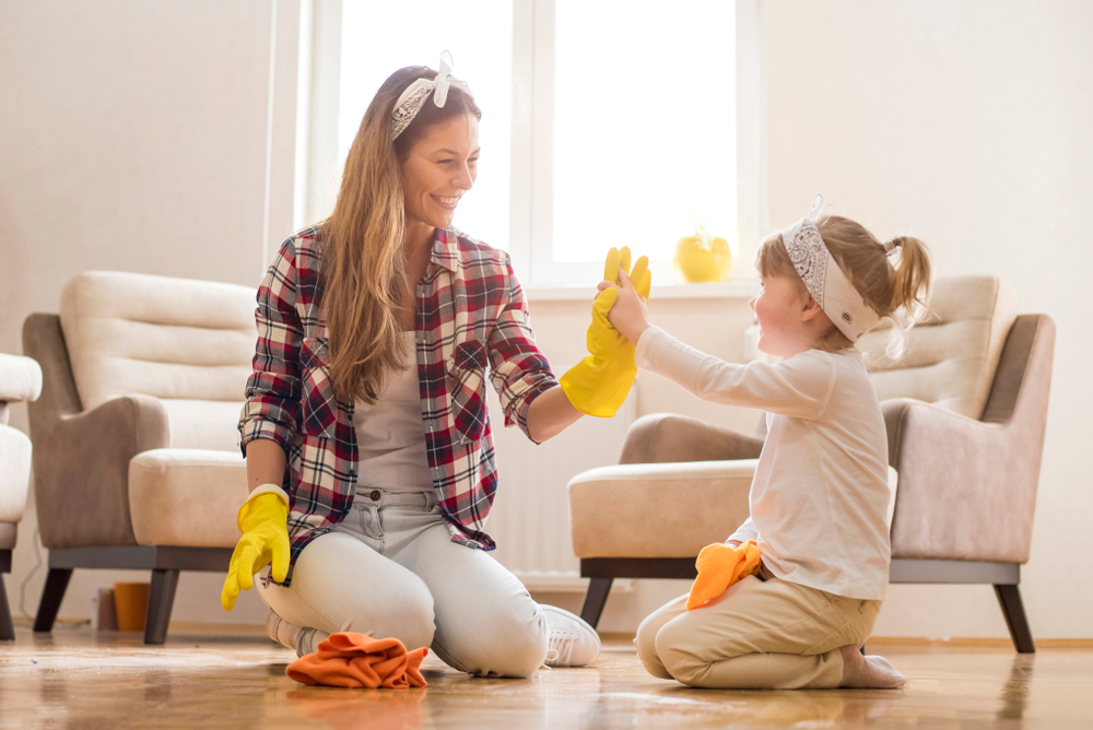 Daughter,And,Mother,Cleaning,Home,Together,And,Having,Fun.